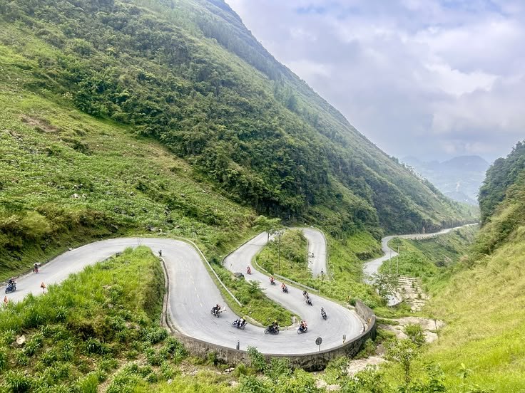 A group of tourists on motorbikes conquering the winding curves of Tham Ma Pass in Ha Giang (Collected Images)