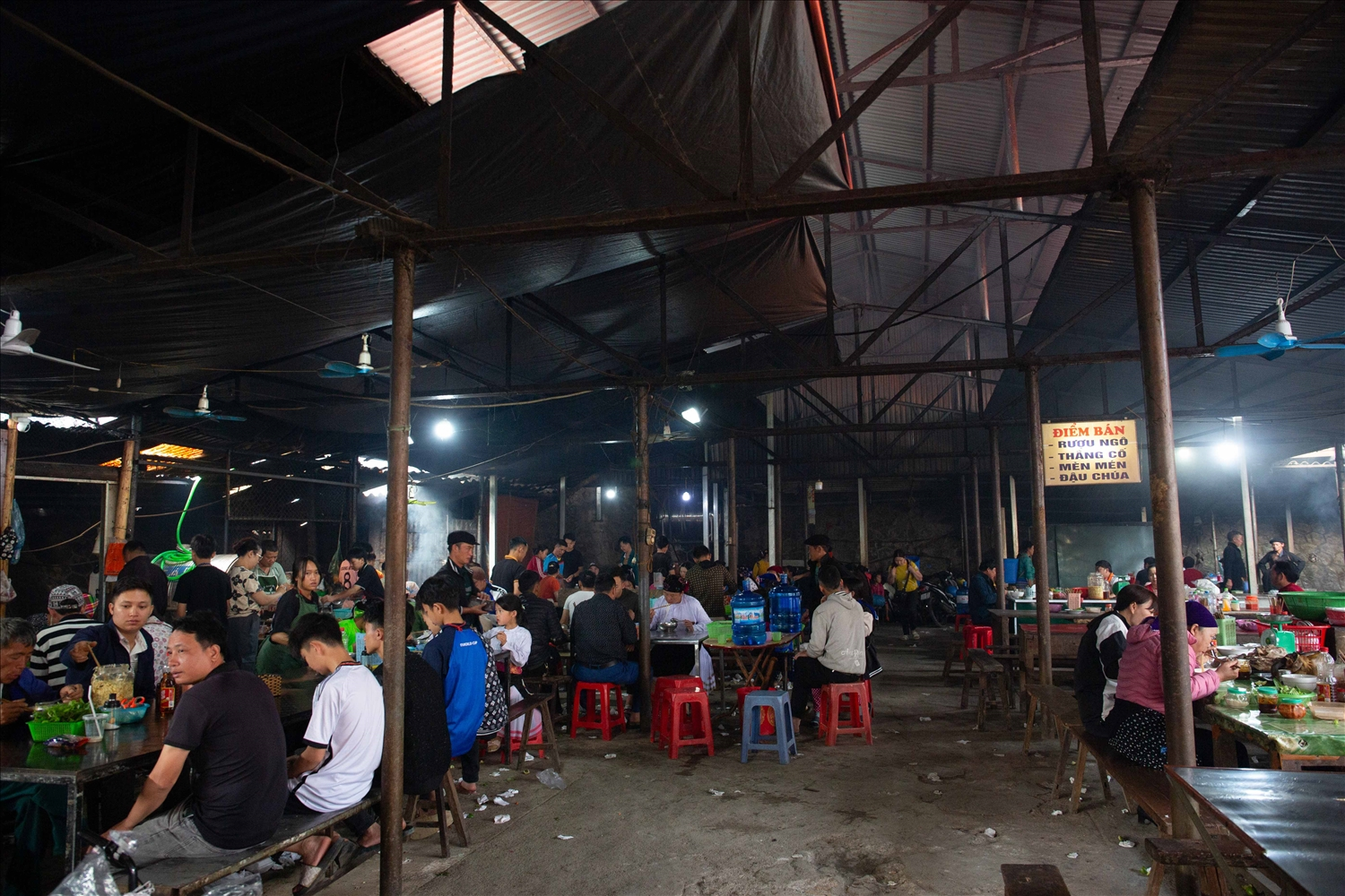 Pho Cao Market panoramic view showing stalls and crowded market space in Dong Van, Ha Giang.